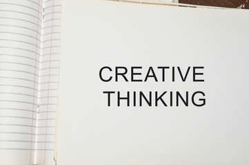 creative thinking written on white paper
