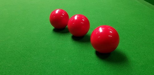 snooker balls on a green table 