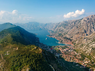 Aerial view of the Bay of Kotor, Boka. Old city of Kotor, fortifications. Mountain of St.John and the fortress. Tourism and cruise ships. The bay is the largest fjord in the Mediterranean. Montenegro