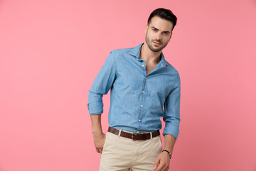 Fototapeta premium young casual model holding hands in a fashion pose