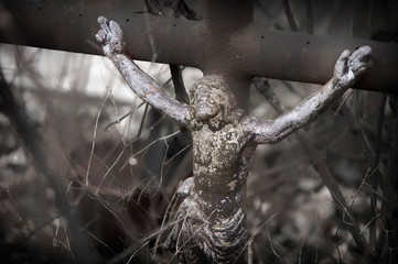 Jesus Christ crucified, an ancient metal sculpture on the old cross