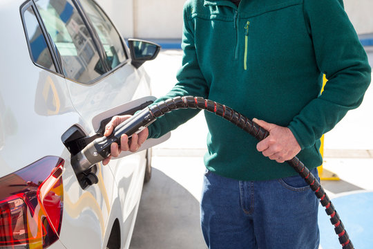 Man Filling Up With Cng (compressed Natural Gas) In His Car.