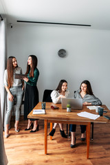 Stylish girls discuss ideas in groups