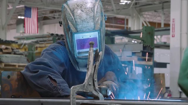 Patriotic Factory Engineer Operating Welding Machine For Product That is  Made In America