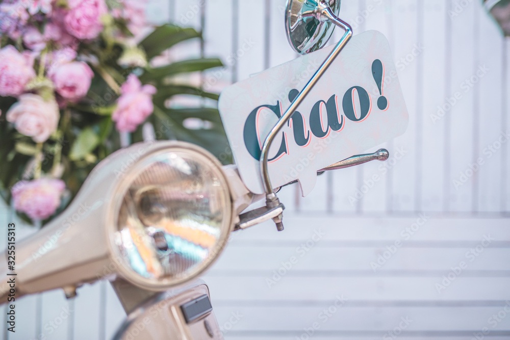 Fototapete word ciao written on a bubble text board stuck behind the handlebar of an italian moto scooter with 