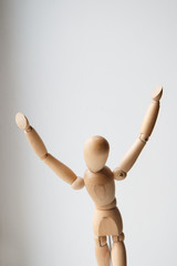 Wooden mannequin with hand on head isolated on white