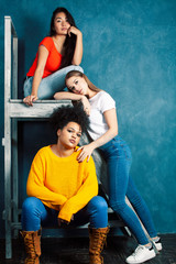 Obraz premium young pretty girls student posing cheerful in classroom together friends diverse nations, lifestyle educational people concept