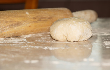 Dough cooked manually, in the process of cooking pies