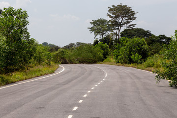 Naklejka premium A road to nowhere in the Malaysian rainforest. The street was build but the destination didn't exist, construction of the road stopes suddenly and the road ends in the jungle of Putrajaya, Malaysia.