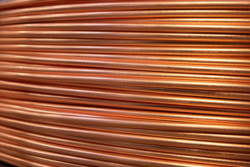 Closeup of copper cables on a reel. Big fat shiny wires.