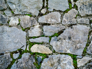 Traditional grey color stone wall texture. Classic craftsmanship.
