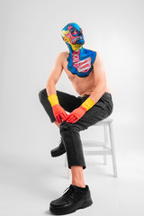 Quaint man with a painted head and shoullder in gloves isolated on white background