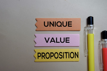Unique Value Proposition - UVP text on sticky notes isolated on office desk