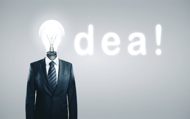 Businessman in suit with lamp