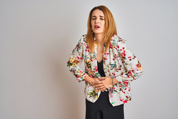 Young caucasian business woman wearing spring floral jacket suit over isolated background with hand on stomach because indigestion, painful illness feeling unwell. Ache concept.