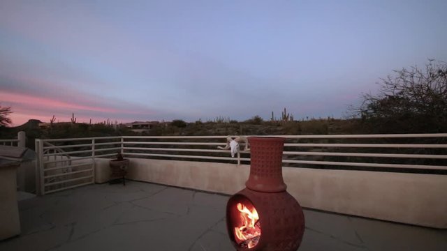Fire Burning In Chimenea At Sunset In Arizona 