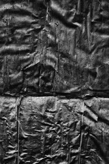 Dark black grey paper background creased crumpled surface / Old torn ripped posters scary grunge textures  