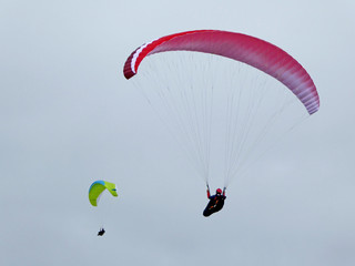 Paraglider flying wing in a blue sky	