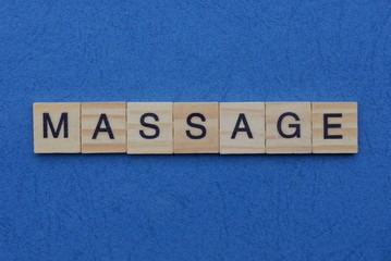  word massage from small gray wooden letters lies on a blue background