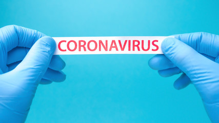 Coronavirus print on blue medical background. Covid-19 - Wuhan Novel Coronavirus pneumonia COVID-19. Healthcare background. Quarantine background. Epidemic. Biotechnology concept. Copy space