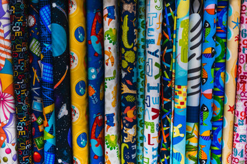 Several fabrics in different patterns and colors