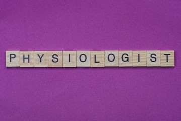 word physiologist from small gray wooden letters lies on a lilac background