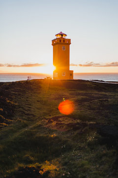 Svortuloft Lighthouse, Hellissandur in The Snaefellsjokull National Park, Snaefellsbaer, Iceland. Orange colorful sunset, good sunny weather.
