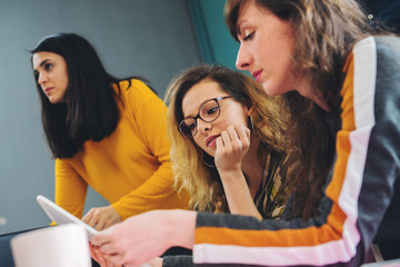 Close Up Shot Of Casual Young Business Team At Work In Creative Office. Brainstorming and sharing new ideas with colleagues
