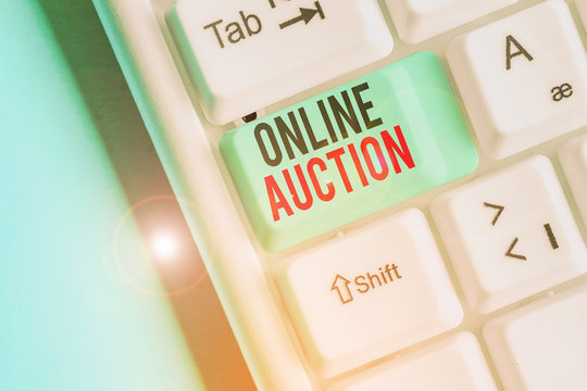 Writing note showing Online Auction. Business concept for process of buying and selling goods or services online