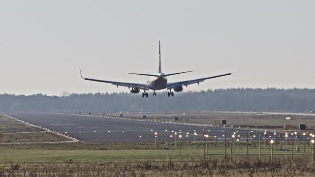 Airplane landing on a runway. Eindhoven, The Netherlands.