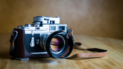 Vintage rangefinder camera with light meter and lens hood for camera clubs photographers and...