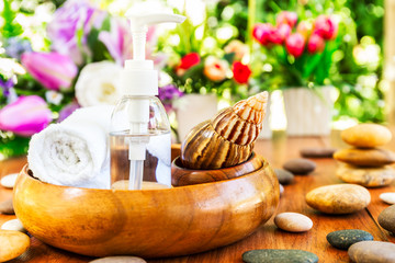 Spa concept snail and bottle essential oil in bottle