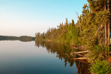 Sunrise reflecting on a fishing lake 