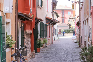 caorle, italy, 02/16/2020 , Little streets in Caorle, a little touristic and hystorical town in the Italian coastline of Adriatic sea.