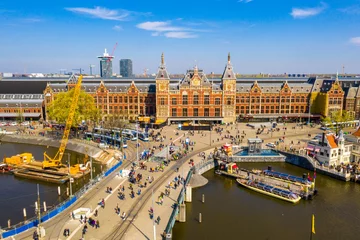 Foto op Canvas  Aerial view of the central train station in Amsterdam which is the oldest station in the Netherlands. © ingusk