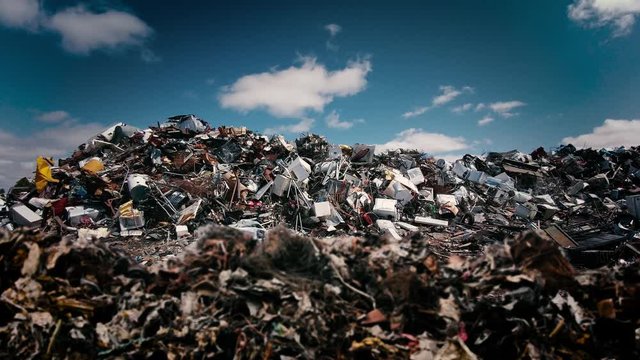 Forward camera shot of garbage waste landfill dump of junky messy unhygienic debris in a junkyard
