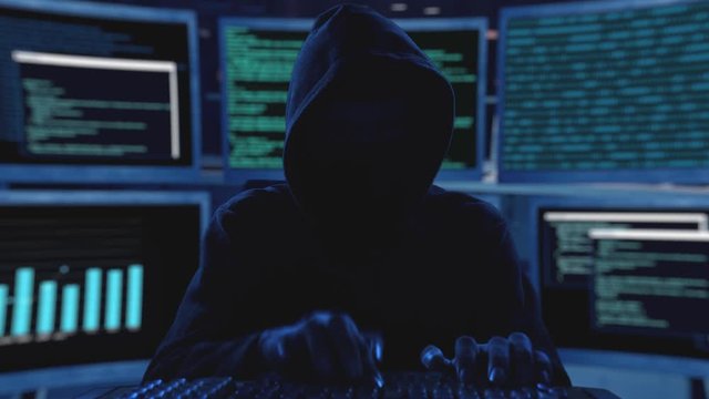 Professional hacker stealing data from computer