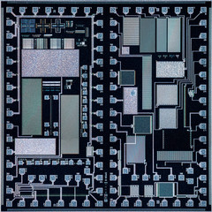 Extreme macro of a generic historic silicon wafer viewed at 10 times magnification, under a...