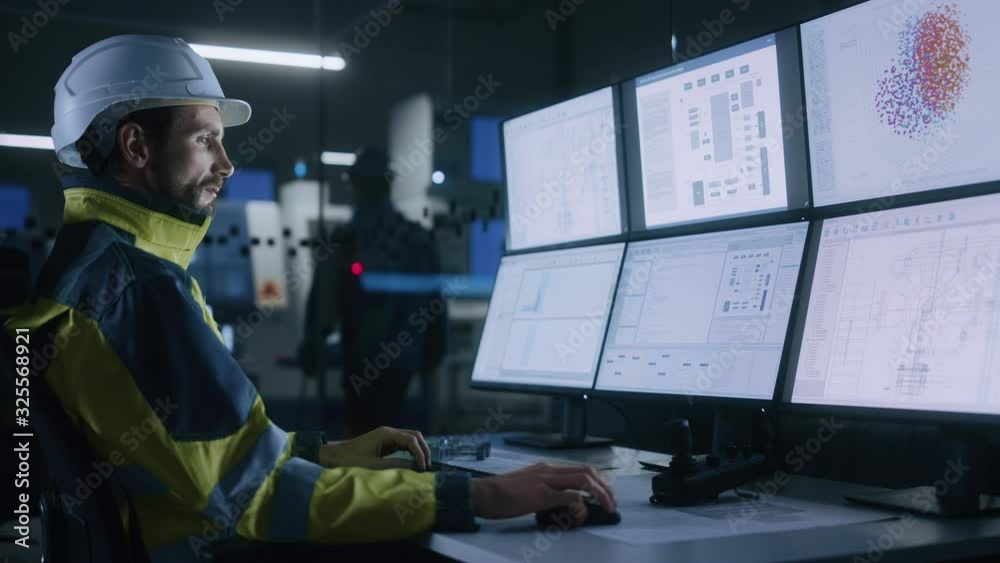 Poster Industry 4.0 Modern Factory: Facility Operator Controls Workshop Production Line, Uses Computer with Screens Showing Complex UI of Machine Operation Processes, Controllers, Machinery Blueprints