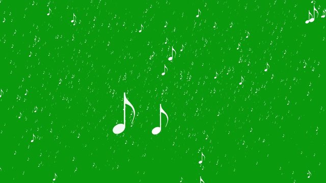 White abstract music notes falling like snow in motion on a green screen chroma key background