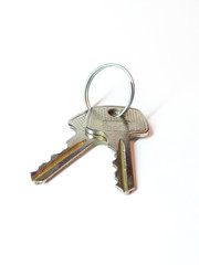 The keys to the lock are isolated on a white background. Set of keys to the apartment. A bunch of keys to the property. The concept of real estate. Buying and selling apartments.