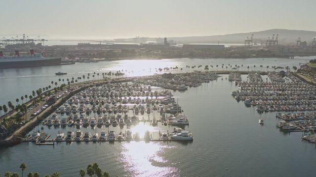 Long Beach CA Aerial v13 Rotating low over sailboat marina and around astronaut island with cityscape views - October 2019