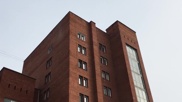 Snow Falling Off Roof Of Apartment Building In Reverse Motion. Ulan-Ude, Russia
