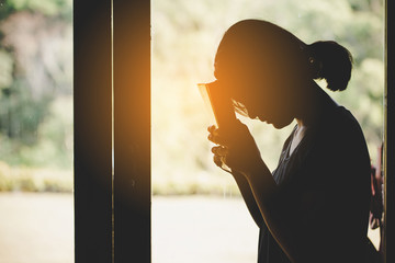 Teen girl pray for god blessing to wishing have a better life.