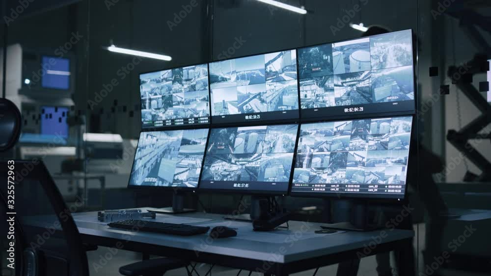 Aufkleber industry 4.0 modern factory: security control room with multipoke computer screens showing surveilla