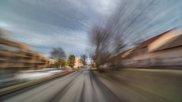 A hyperlapse video. Driving on freeway. Speeded up video. The sky, clouds, trees on the sides of the road, fields, vegetation, passing cars are just a blur. Cars racing past.