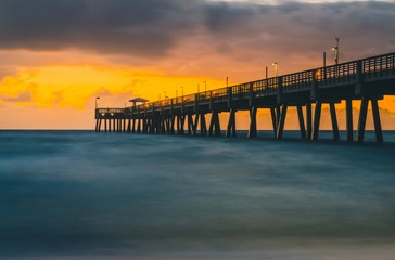 Fototapeta na wymiar sunset sun sea bridge water beach orange sky landscape florida sunrise ocean coast calm beautiful blue yellow