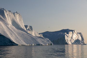 Ice glaciers in Diski Bay during the midnight sun, Ilulissat Icefjord, Greenland