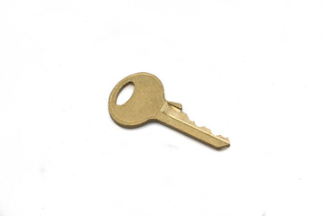 A brass padlock key, close up, isolated on a clean, white background.  Shot in macro.