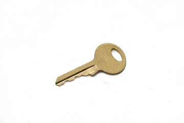 A brass padlock key, close up, isolated on a clean, white background.  Shot in macro.